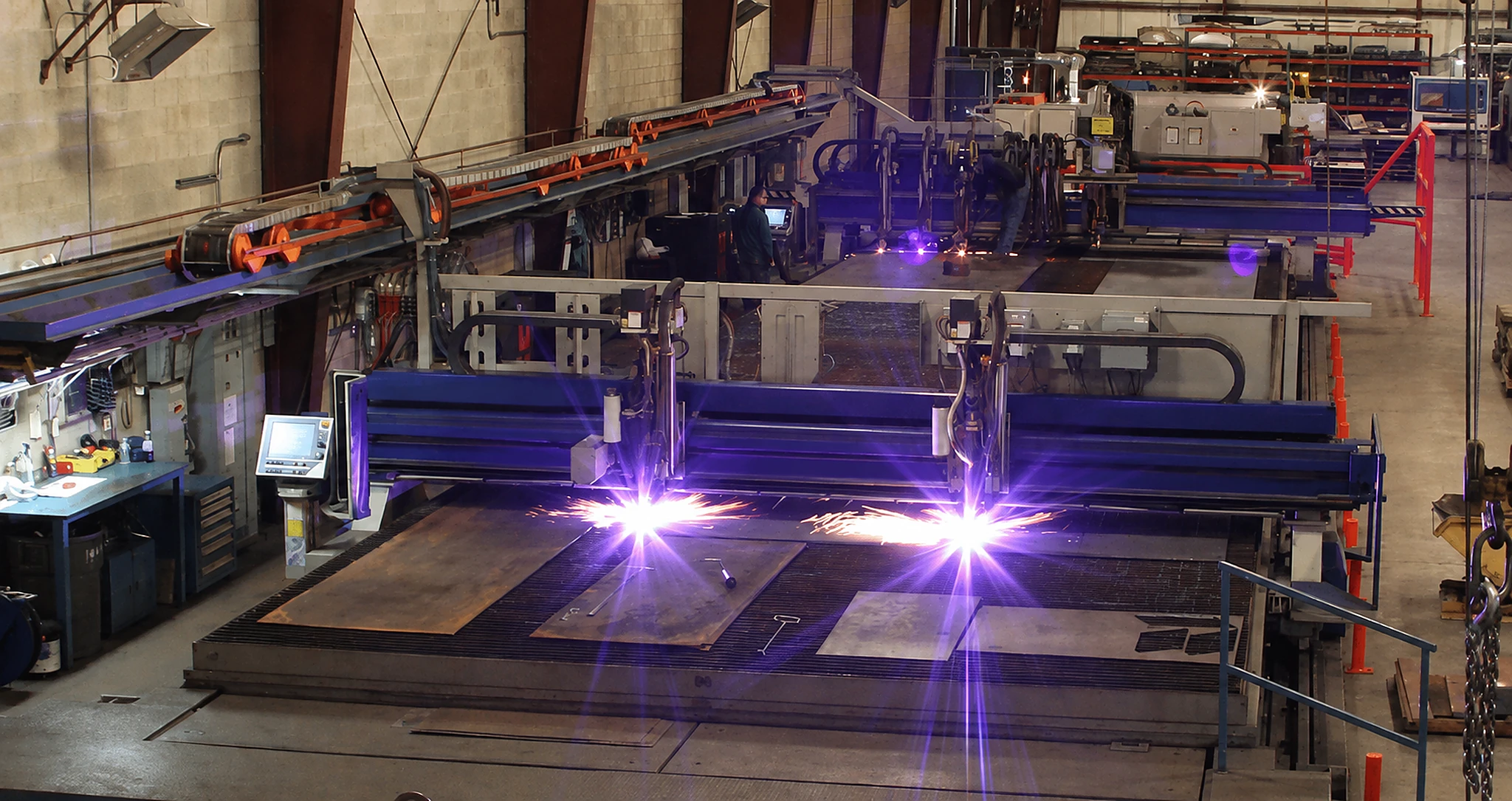 CNC gantry plasma cutting machines operating in a fabrication workshop